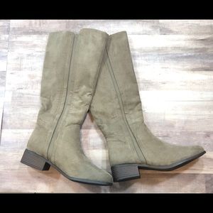 Calf high, low heeled boots.